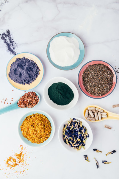 variety of spices in small bowls with white background